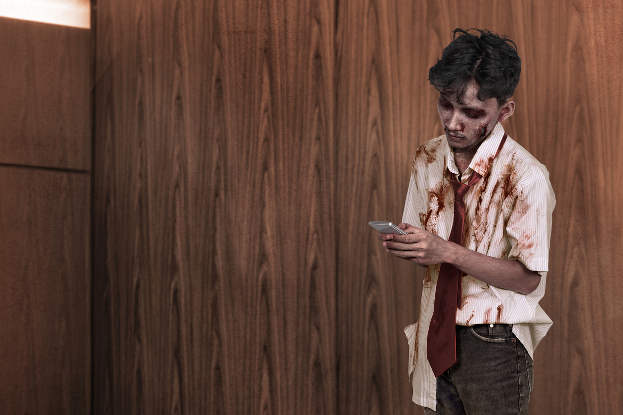 A student zombie scrolling social media on his mobile phone