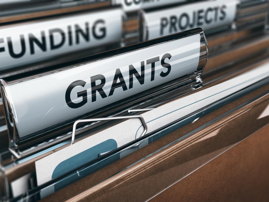 Filing cabinet with files labelled "funding" and "grants"