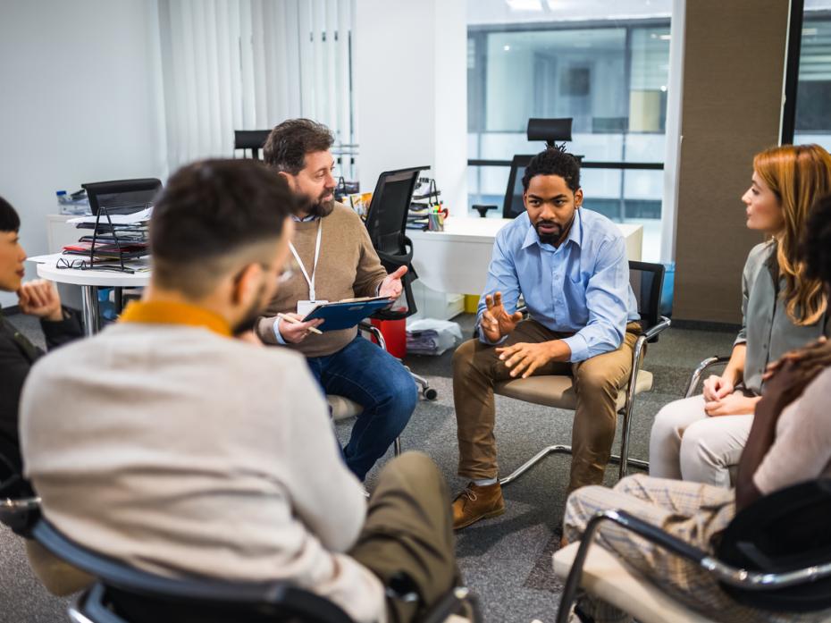 Participants of a focus group chatting in a circle