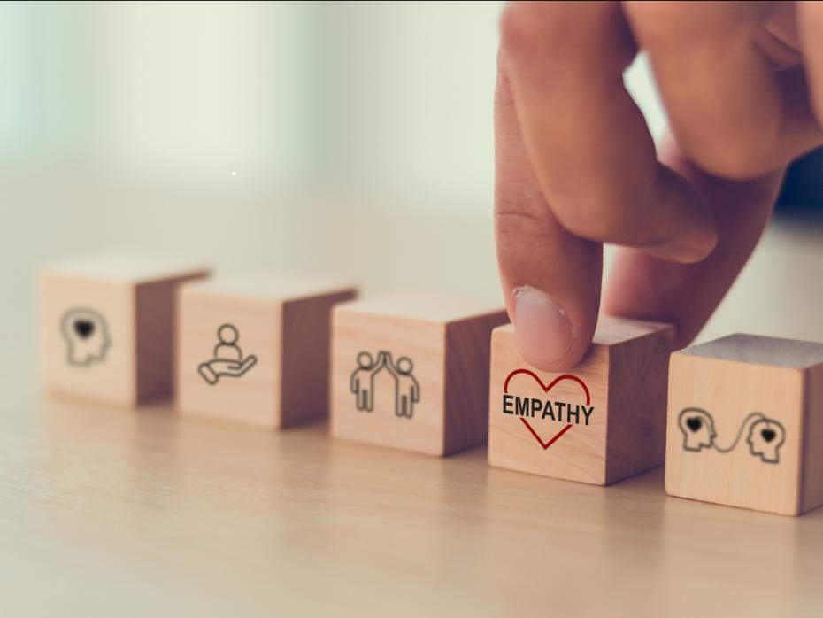 Wooden blocks, one with the word "empthy" inscribed on it