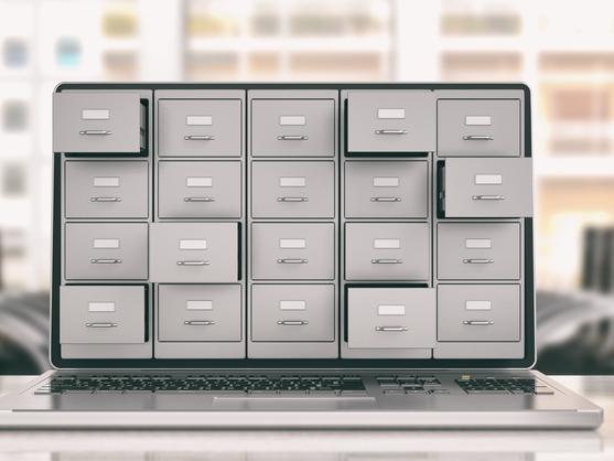 A laptop screen with many different storage drawers opening