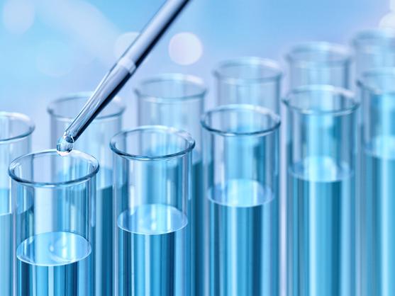 A close-up of blue liquid in test tubes