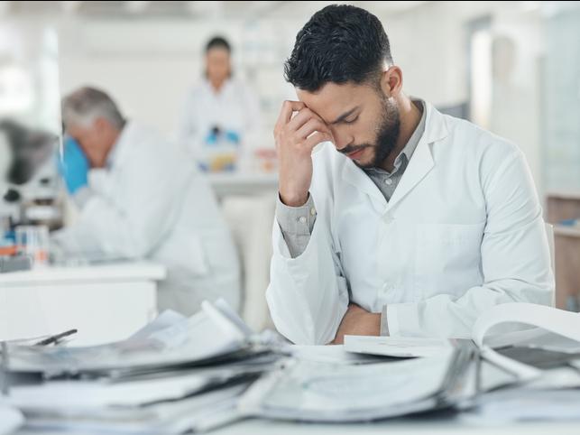 A science student struggles in a lab