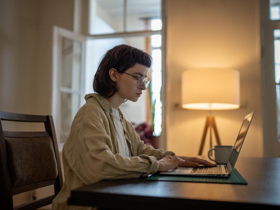 A woman studying at her laptop