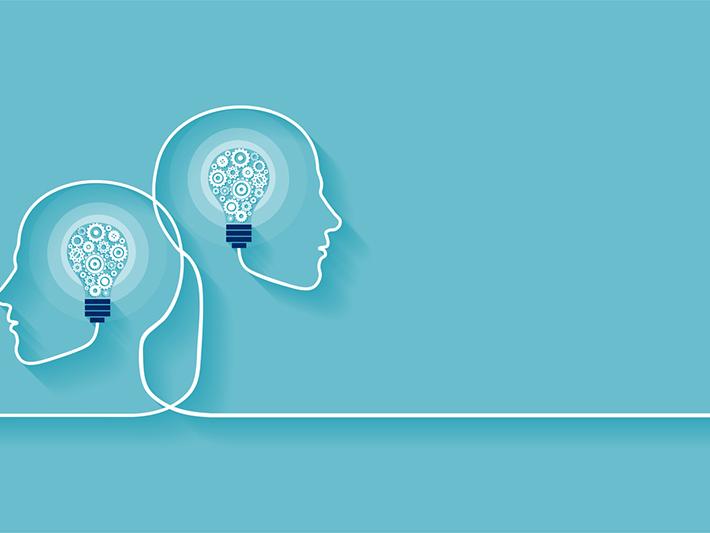 Illustration of two head outlines with lightbulbs