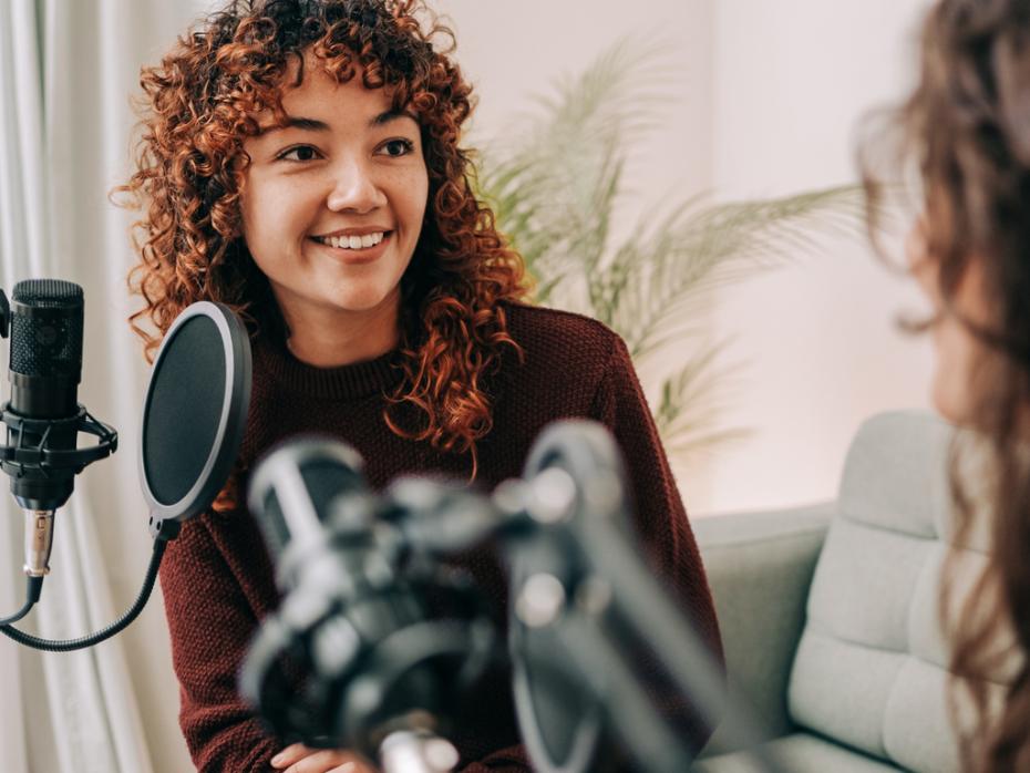 A podcaster interviewing a guest speaker