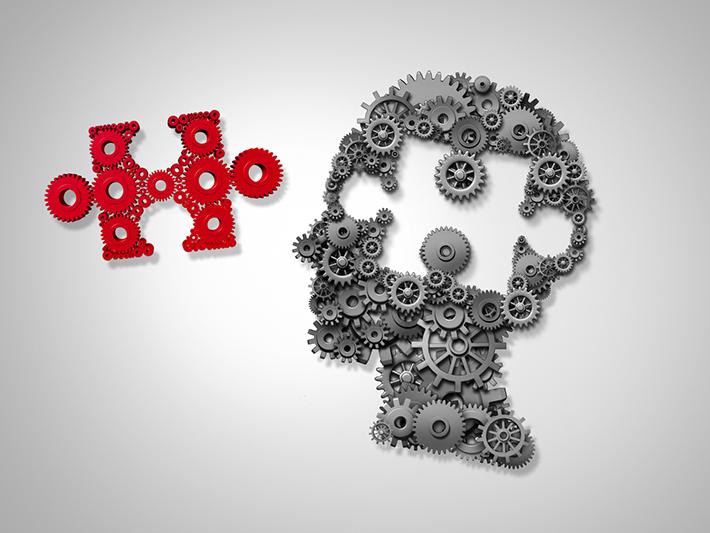 Head made of cogs and jigsaw puzzle piece