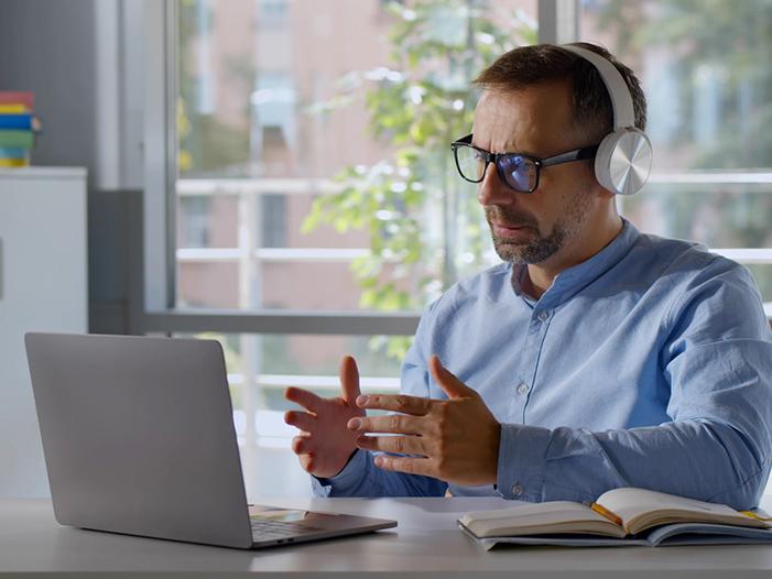 Mature white male student doing online training
