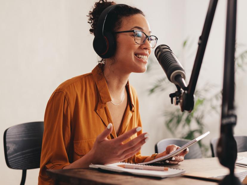 A podcast host speaing to an unseen interviewee