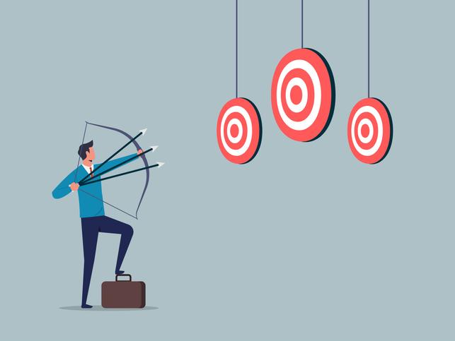 An illustration of a businessman attempting to hit three targets with one bow