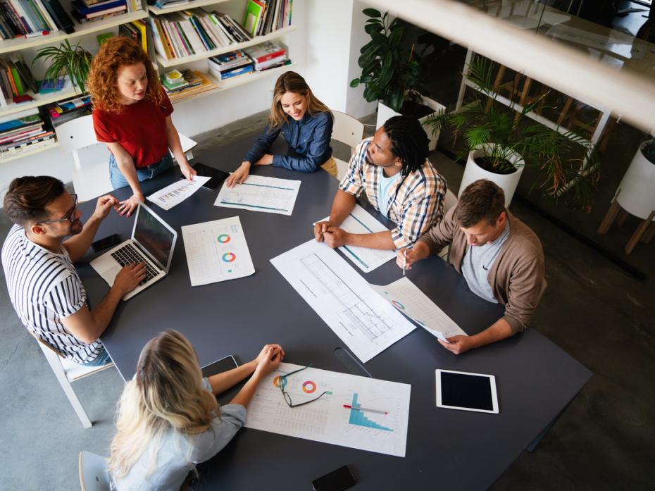 A group of people having a discussion at a table
