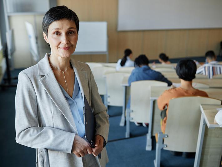 Female college teacher in class