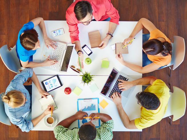 Students work round a square table