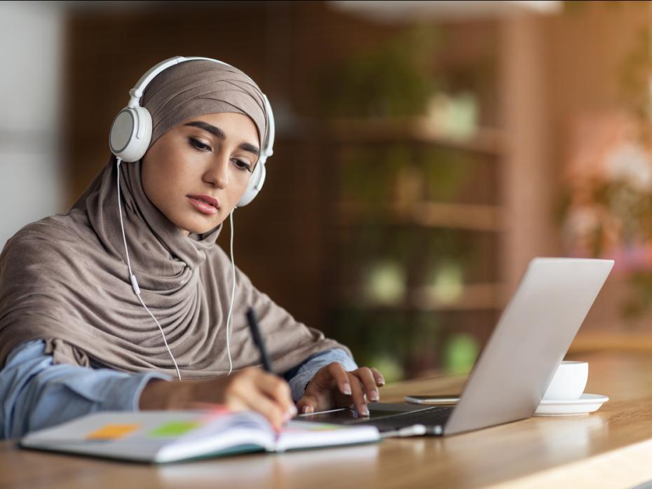 A student studying at her laptop