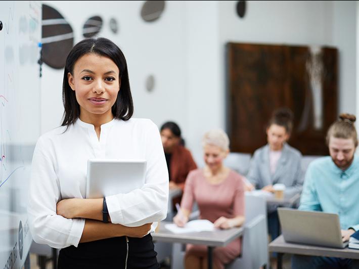 Young female teacher in classroom