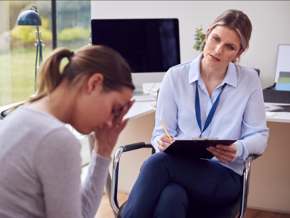 A teacher helping a student with mental health issues