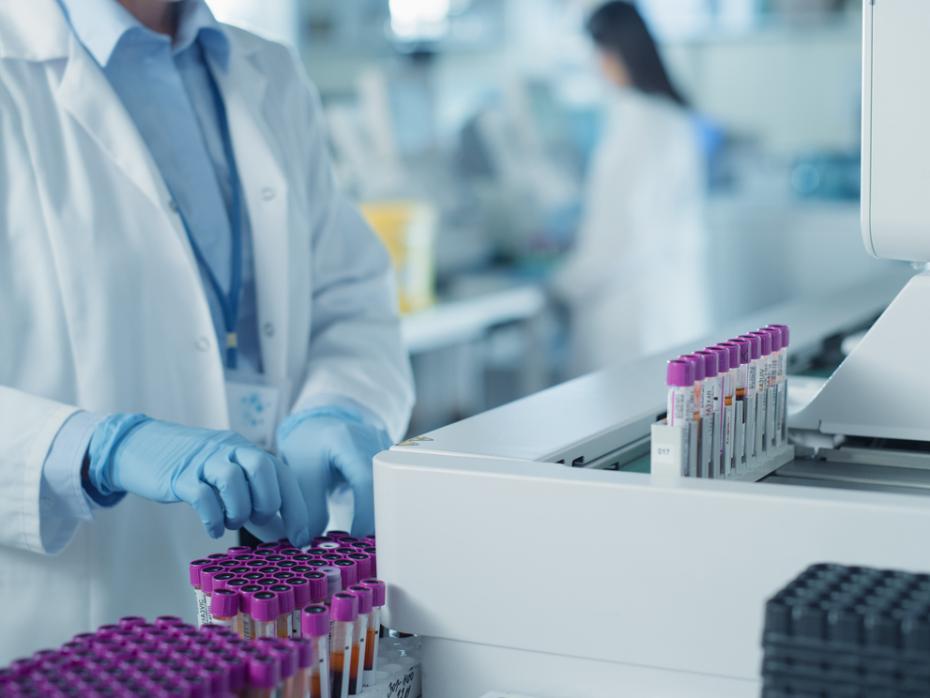 A researcher in a lab sorting test tubes