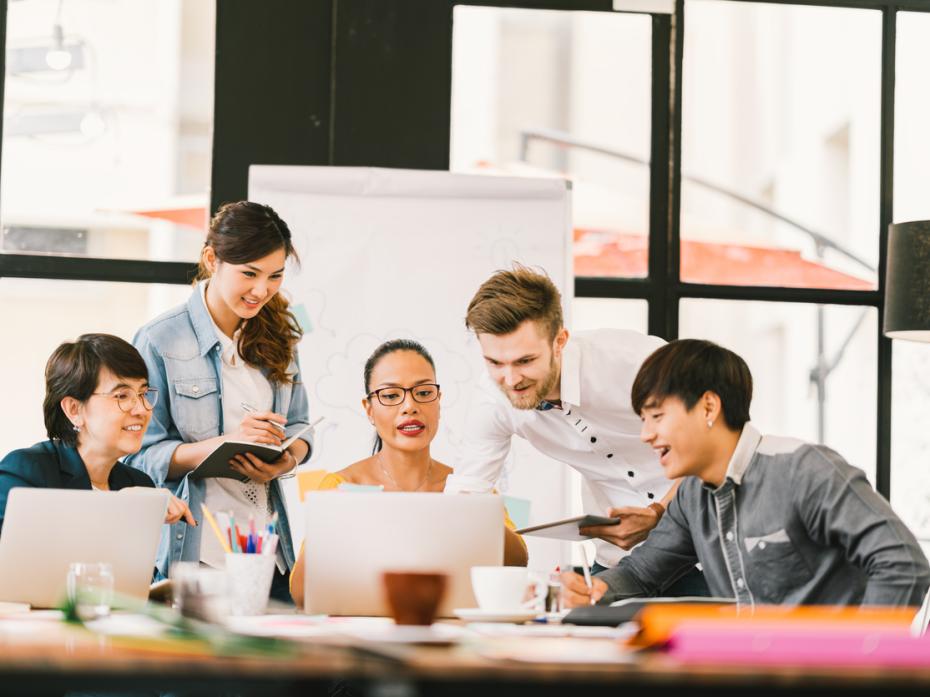 A group of students in a classroom working on a live brief