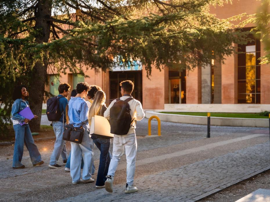 A group of students outside a campus building
