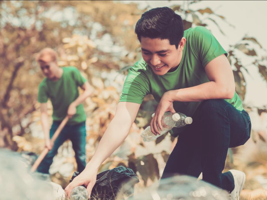 A student picking up litter
