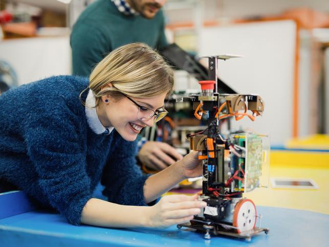 A woman works on an engineering project