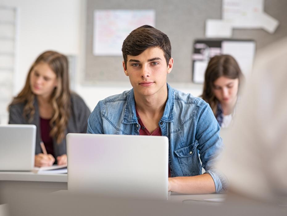 Good looking male student in a university class