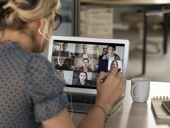 A student on a Zoom call with other online students