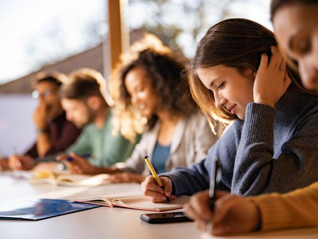 Students concentrate on writing in class
