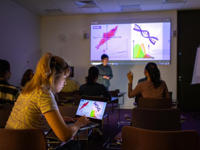 STEM students watch and interact with a classroom presentation