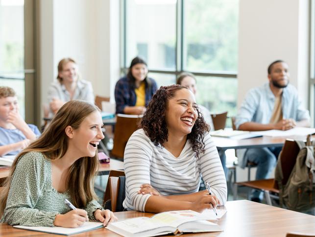 Students laugh in a classroom