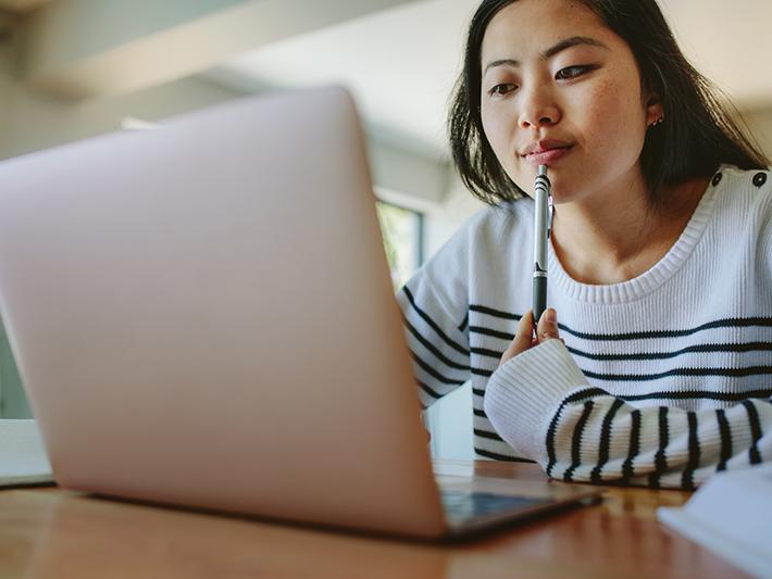 Asian woman studying at home