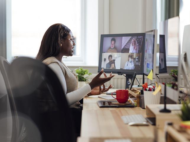 A student on a zoom call in her home office