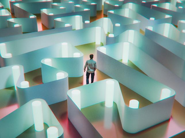 Man tries to find his way through a maze