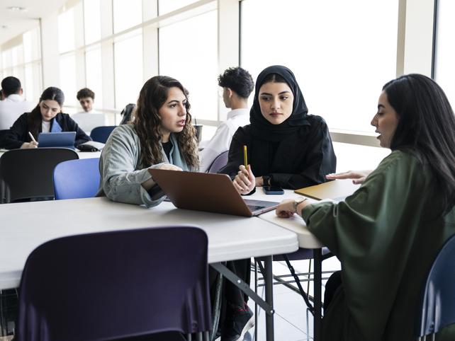 Muslim law students discussing a case in class
