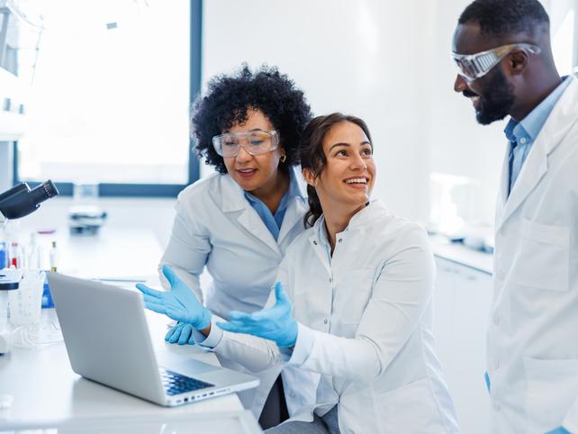 Scientists work together in a lab
