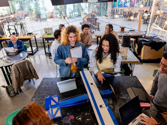 Students developing a model aeroplane at an event