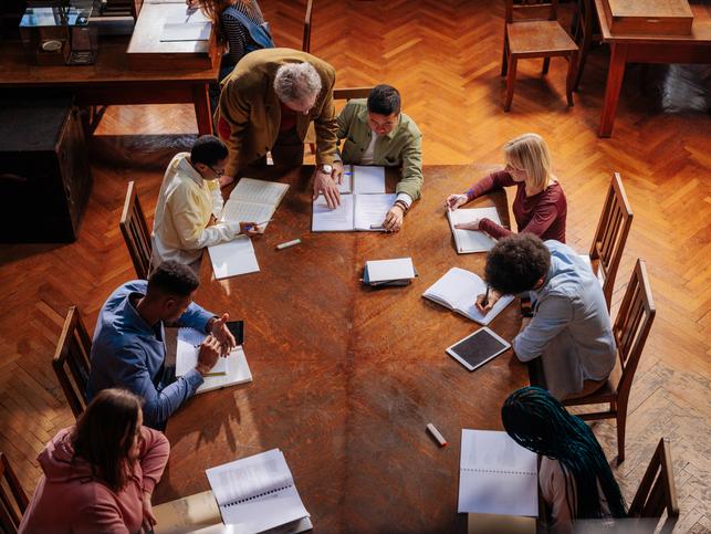 Students study together under the teacher's supervision