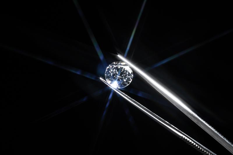 Diamond held in tweezers