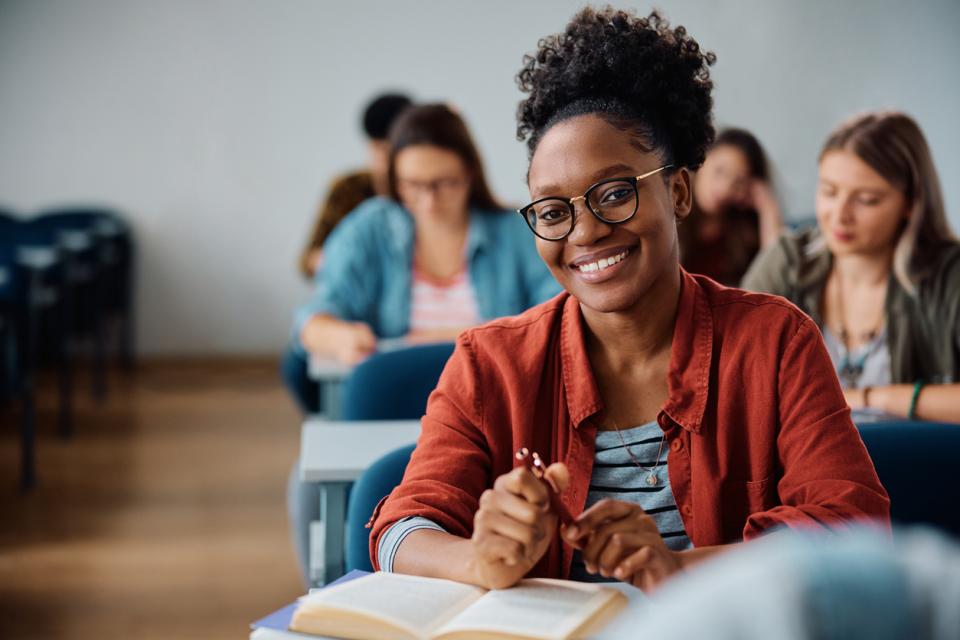 A student smiling to camera