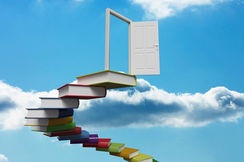 Stairway of books leading to open door