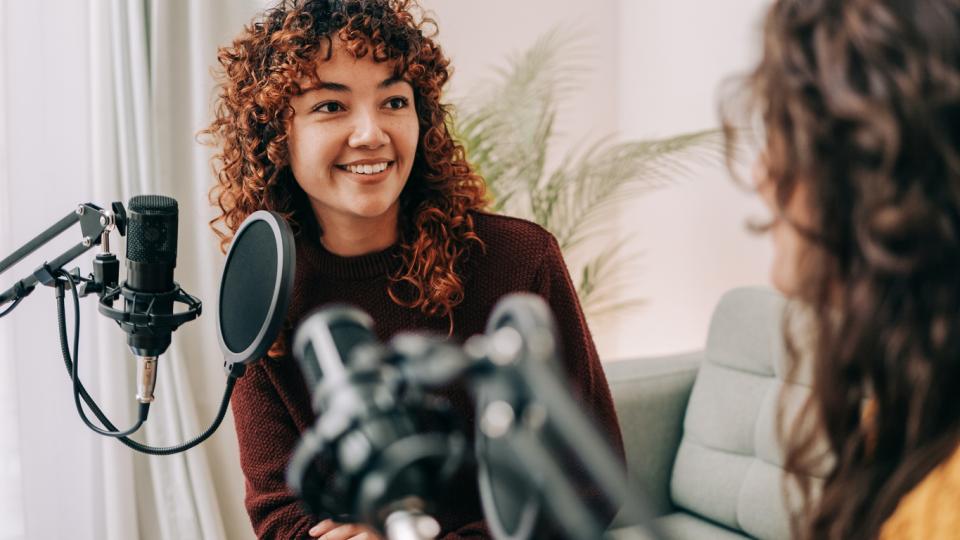 A podcaster interviewing a guest speaker
