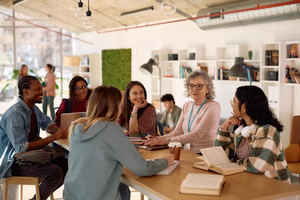 A teacher having a discussion with students