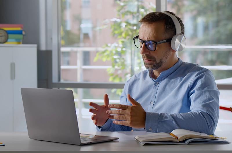 Mature white male student doing online training