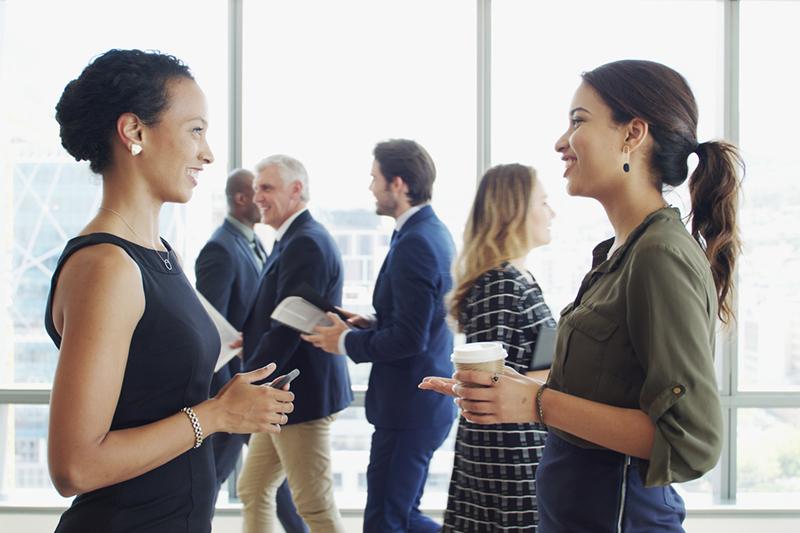 Businesswomen in conversation