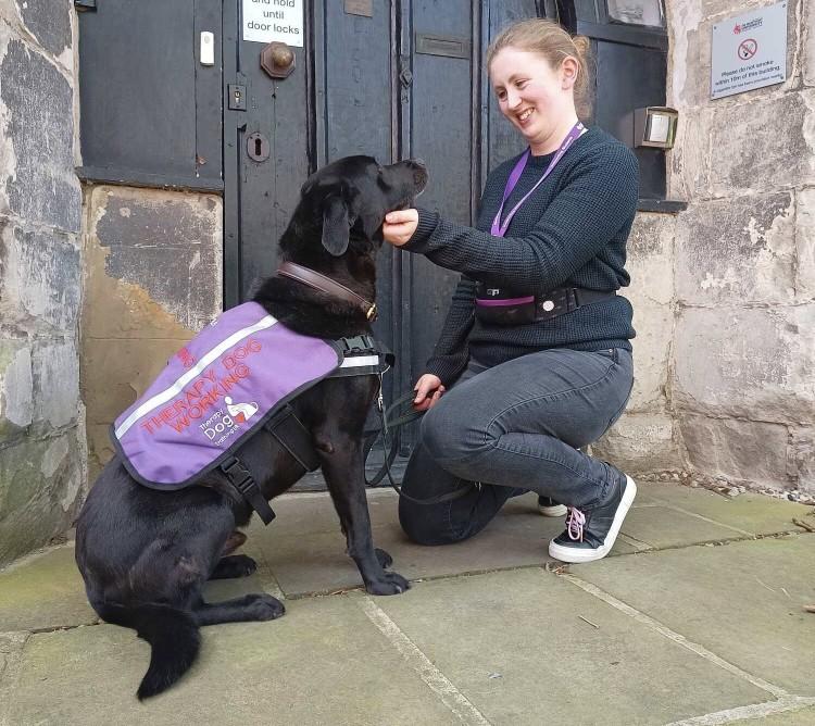 Cara, therapy dog, and Tabitha Biller, specialist autism mentor