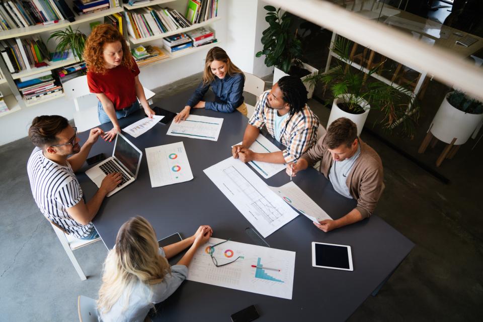 A group of people having a discussion at a table