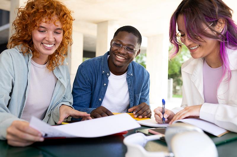 Group of happy multiracial university students