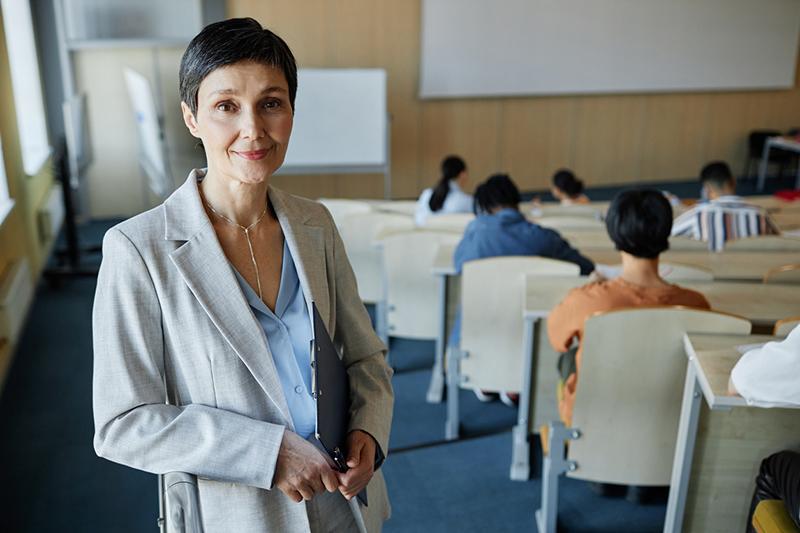 Female college teacher in class