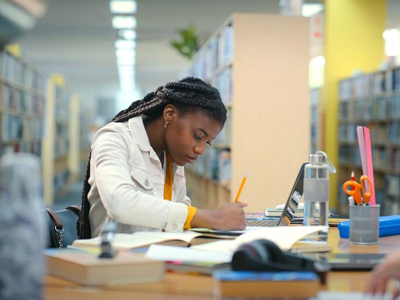 Student working in a university library