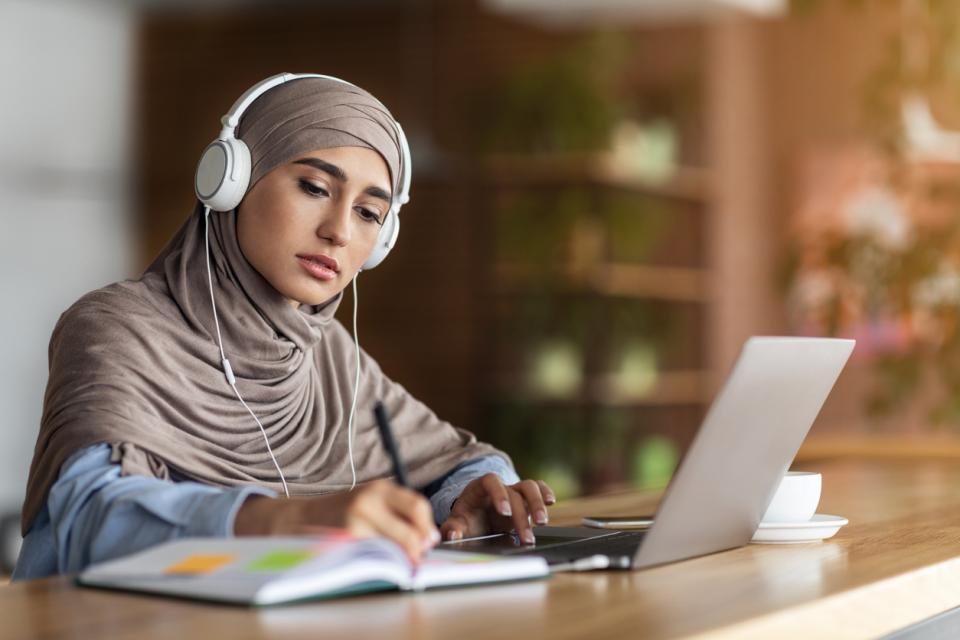 A student studying at her laptop